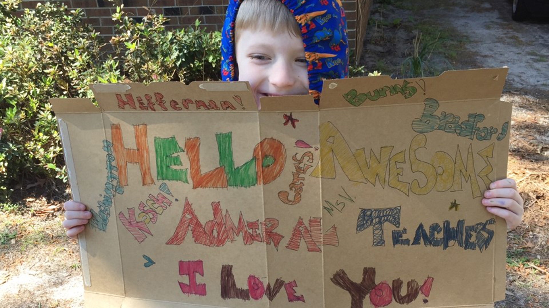 My grandson’s school in Wilmington NC teachers did a drive by parade for the students. My 6 yr old grandson made a sign for them expressing love. Landen loves his teachers.