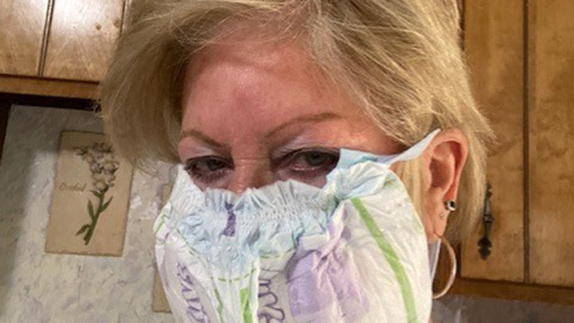 I just thought I would share this little stroke of genius. After hearing home made cloth masks were not any good, and later being told they are; my wife tried (without much luck) to follow the many of the suggestions on how to make a mask without sewing. Today she came up with a great idea and texted me the attached photos. This mask was made from a disposable diaper and a drawstring from a pair of sweat pants. It was easy to make and creates a great barrier. Thanks to our new grandson for donating the material. Dorsey Worthington Cincinnati, Ohio