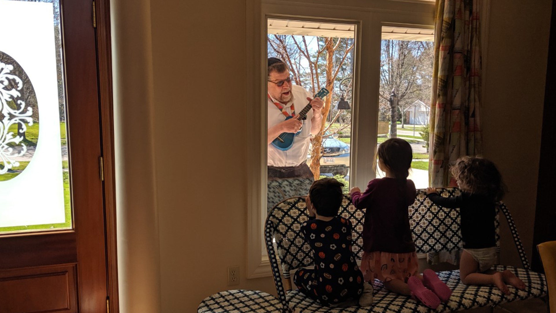 I am visiting my my grandkids through a glass window in Cleveland Ohio