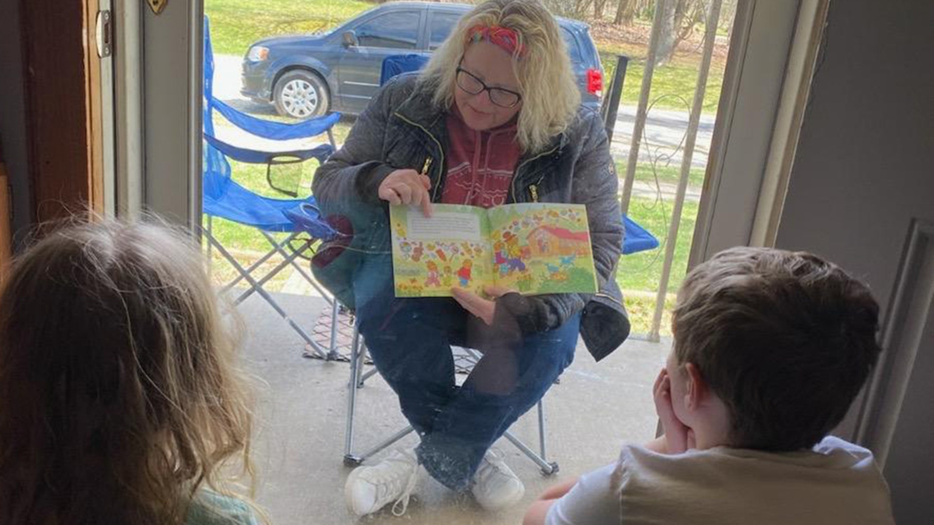 This is my friend who was dying to see her grandkids! They barely cracked the door so the kids could hear her read the book! She told me she cried as she drove away. She's the best Mimi ever!