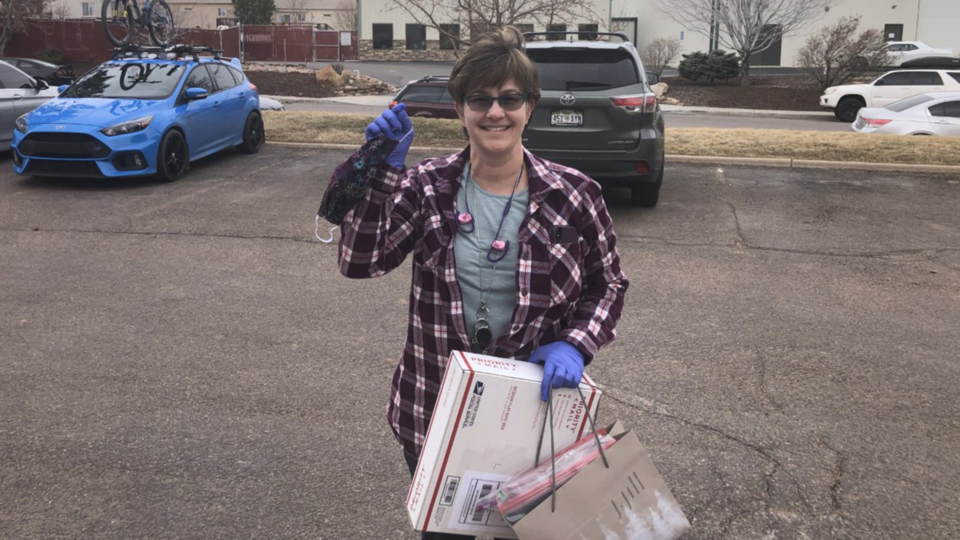 Heidi Bates, delivering cloth masks to the factory we both work at. She is one of the many Americans staying at home during the Covid-19 event. She is spending her time making these in an effort to provide some help to all of us who remain at work, so that fabricated masks can be more appropriately supplied to the medical community. She is an amazing Engineer, peer and person