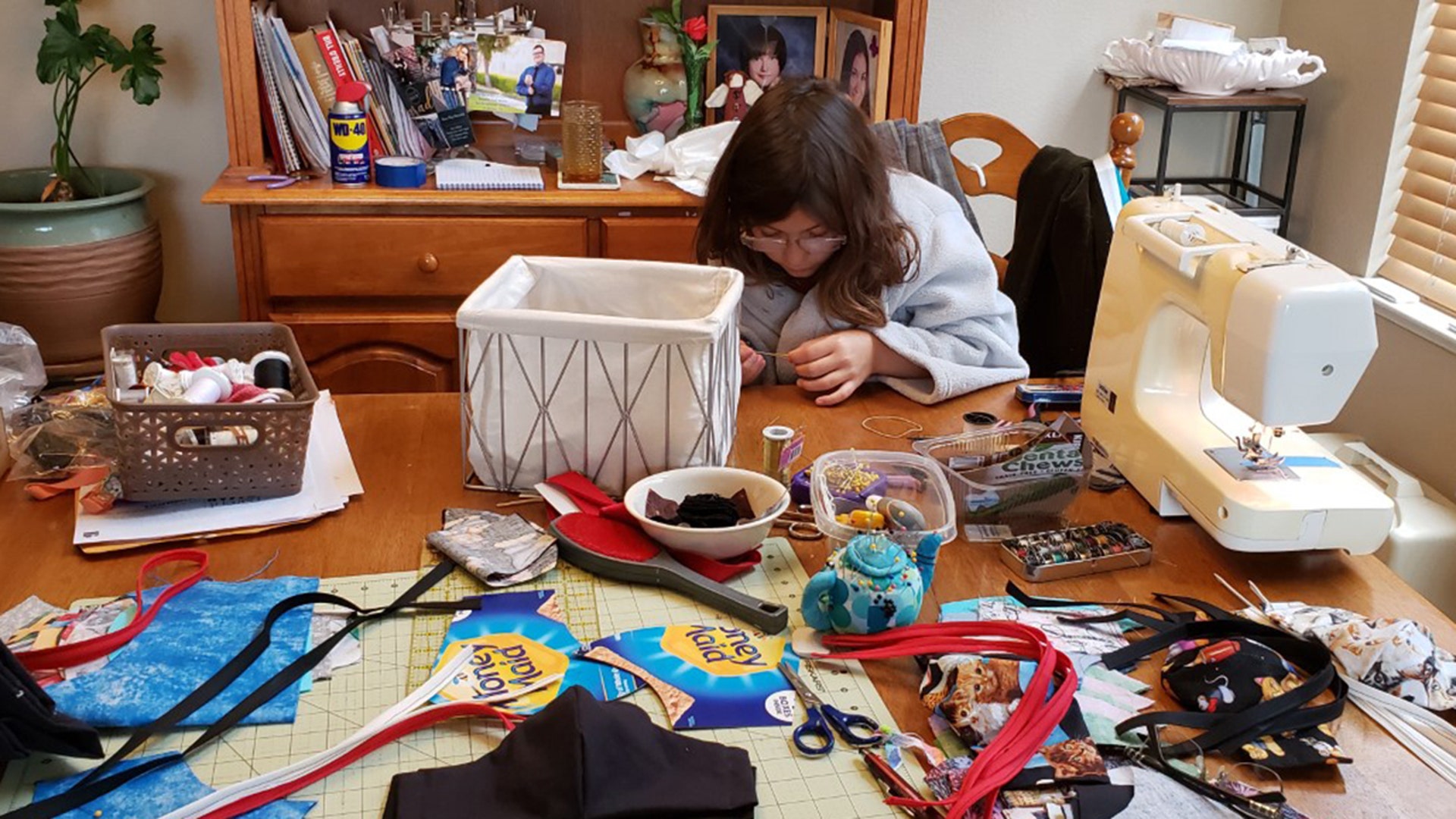 My granddaughter, Mahra Martin helping me make masks to donate. She said "We're saving the world!" Deborah Hurtt Tracy, Ca