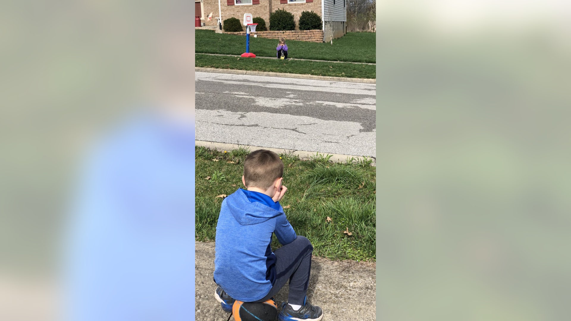 Jackson (3 years old) and Tennleigh (3 years old), neighbors who live in Lawrenceburg, KY, social distance themselves during the Covid-19 outbreak, but they can’t fully understand why they can’t really play together.