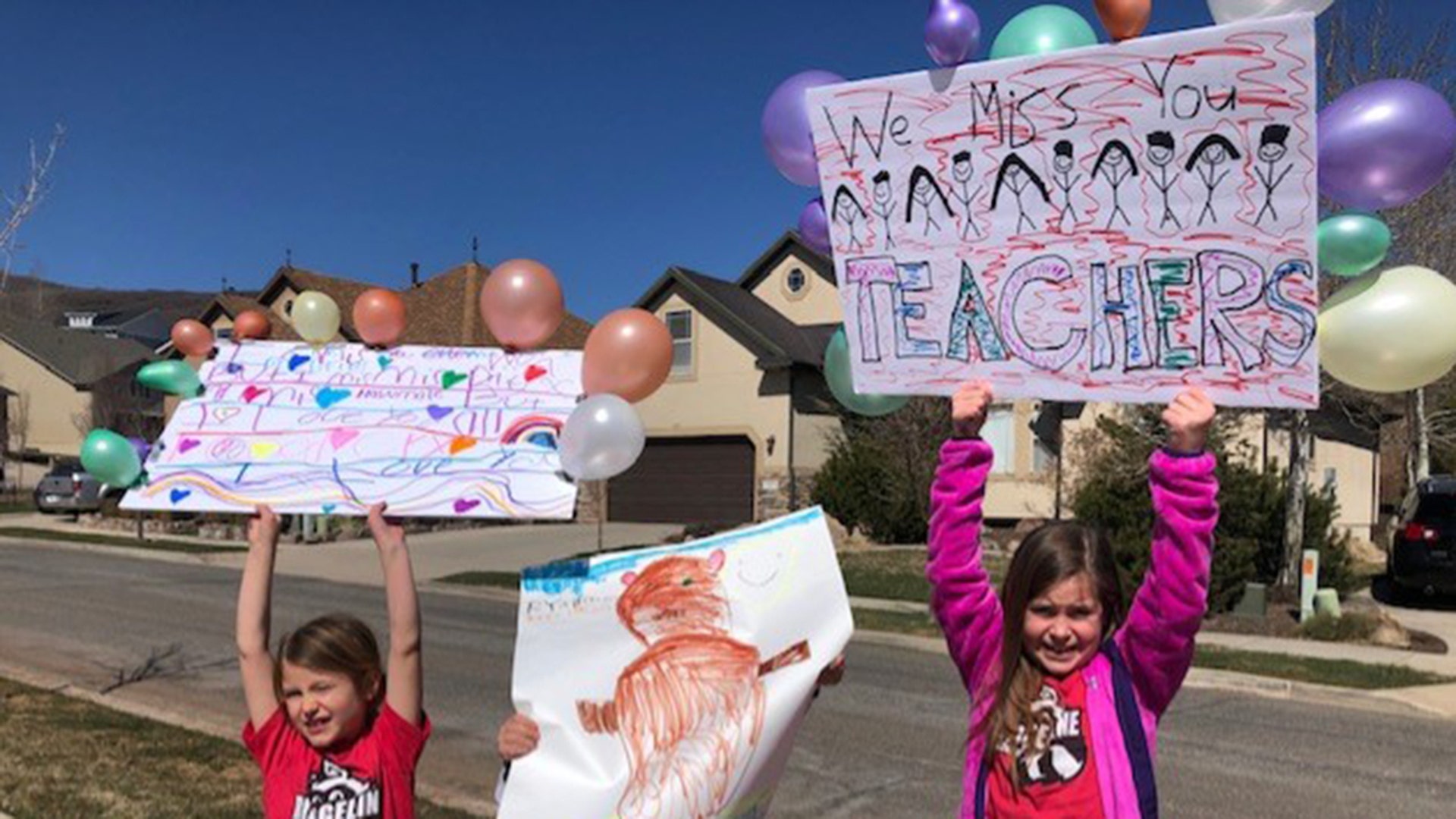 Hi there, I wanted to share a heartwarming way Ridgeline Elementary School (Alpine, UT) stayed connected with students today amidst the Corona virus shutdown. They held a teachers parade where teachers decorated their cars and drove through the school boundaries! The school emailed parents the night before so the kids could go out on their driveways and wave to their teachers as they drove by. Our kiddos made signs and wrote notes on the sidewalk in chalk to their teachers. Everyone was all smiles, honking and cheering and waving to each other from a distance as they drive by. It was such a neat way to feel connected and know we’re all in this together. I’ve attached some pictures; feel free to share. Thanks for running this America Together campaign. It’s heartwarming to see how we all truly are coming together in crisis.