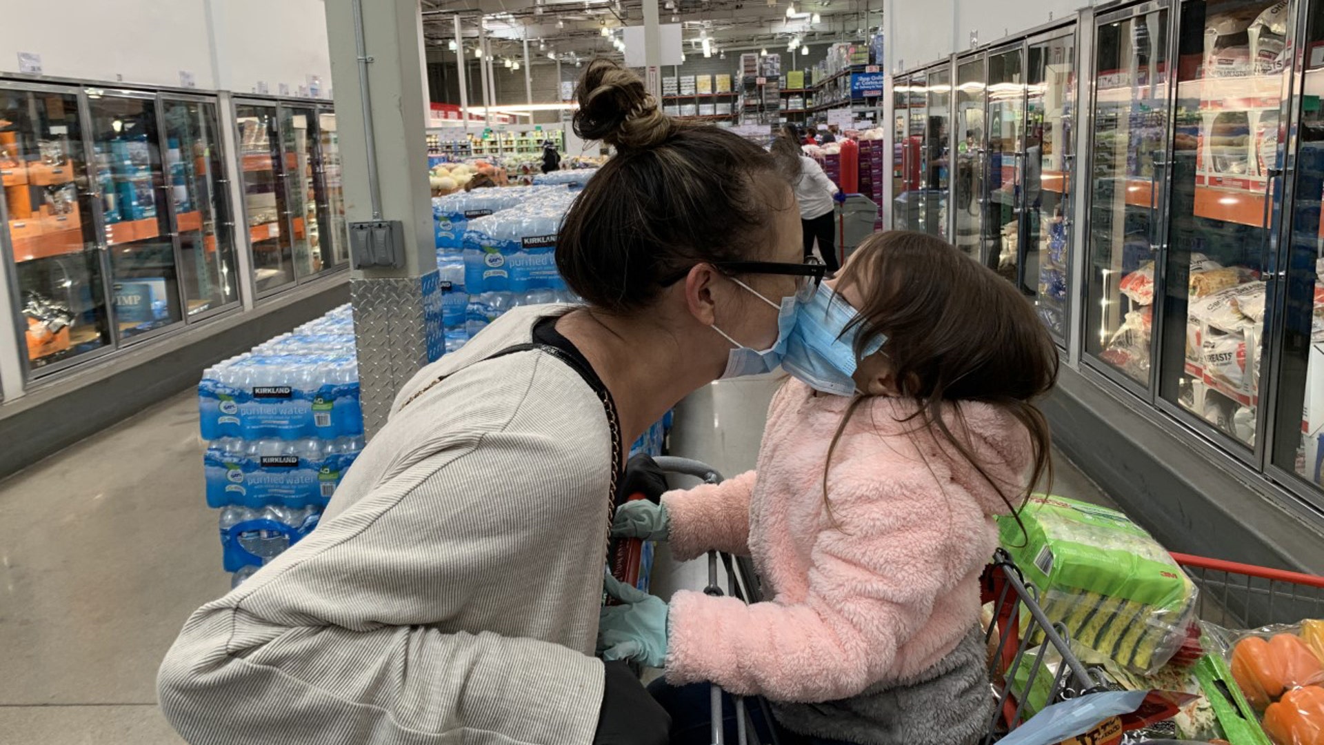 A Mother and young daughter share an intimate moment in a Costco in Los Angeles. Mother (36) - Aurora Lindsey Daughter (4) - Arielle Lindsey