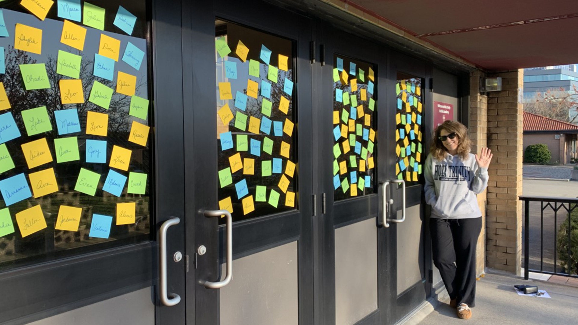 Principal Barbara Kavanagh posts names of all the school’s students on entry doors of Holy Trinity to remind students how much they are loved and missed. Thank you, teachers, too for being heroes for our kids!