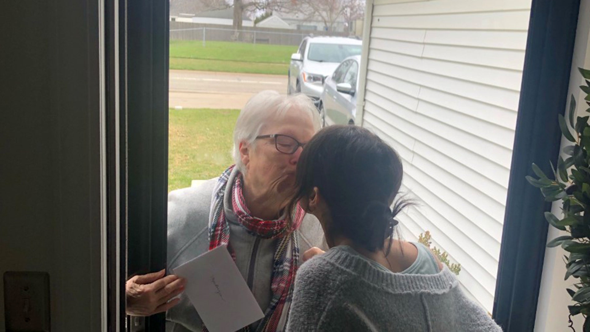 My daughter had her 24 th birthday on March 31st. We are under a Stay atHone order in Michigan. My mother is 73 she has diabetes and is considered high risk to the Corona Virus. My daughter is her oldest grandchild and she has never missed one of her birthdays. We were surprised when we heard a Knick on our front door. There stood my mom with a card and tears in her eyes. Please see attached photos for this touching moment Thank you Shannon Carter