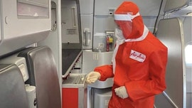 AirAsia launches new flight attendant uniform with long sleeves, face mask and hood