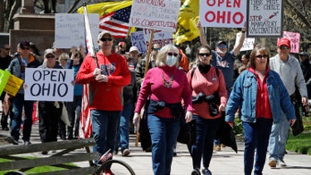 Ohio protester confronts masked reporter: ‘You’re terrifying the general public!’