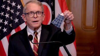 Ohio's DeWine reverses coronavirus mask mandate for retail customers as he lays out gradual reopening