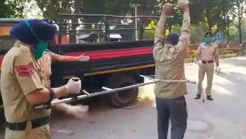 Police in India reveal device to detain coronavirus lockdown violators without contact