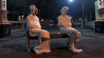 Coronavirus patrols in Indonesia village use 'ghosts' to enforce social distancing