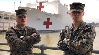 Marines race down NYC pier carrying oxygen tanks to help save patients outside USNS Comfort