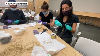 College students using 3D printers to make face masks for coronavirus first responders