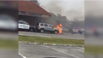 Burning car pushed from Taco Bell drive-thru by NJ police officer