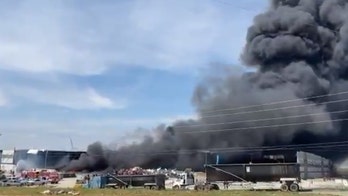 Tornado-damaged warehouse in Tennessee catches fire during cleanup operation