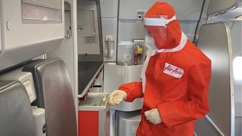 AirAsia launches new flight attendant uniform with long sleeves, face mask and hood