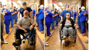 Wisconsin couple recovered from coronavirus cheered by staff during discharge