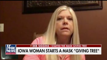 Iowa woman sets up 'giving tree' of face masks on family farm amid pandemic