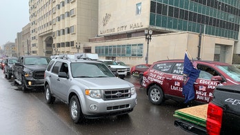 Drivers swarm Michigan capital to protest coronavirus lockdown measures