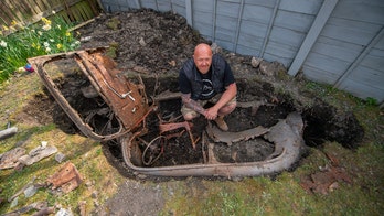 Man working in yard during coronavirus lockdown discovers mysterious car buried for over 50 years
