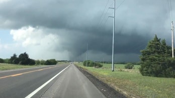 Deadly tornado in Oklahoma seen up close as it tears through buildings, sends debris flying
