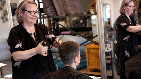 Danes rush for haircuts after government takes new steps in easing coronavirus restrictions