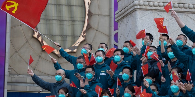 A farewell ceremony is held for the last group of medical workers who came from outside Wuhan to help the city during the coronavirus outbreak in Wuhan in central China's Hubei province on Wednesday, April 15, 2020.