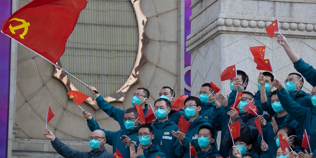 A farewell ceremony is held for the last group of medical workers who came from outside Wuhan to help the city during the coronavirus outbreak in Wuhan in central China's Hubei province on Wednesday, April 15, 2020.