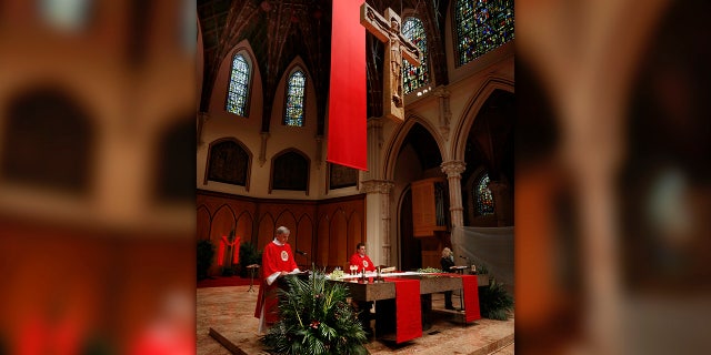 Father Marek Smolka, Associate Pastor and Director of Liturgy at Holy Name Cathedral, was the main celebrant during Mass taped in Polish for Palm Sunday on April 3, 2020 at Holy Name Cathedral in Chicago. In light of COVID-19 pandemic where all public Catholic Liturgies have been suspended since March 15, Masses have been taped and live-streamed in 3 languages for the faithful to worship online. (Karen Callaway/Chicago Catholic)
