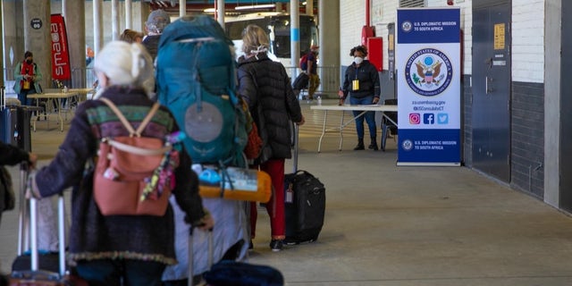 U.S. citizens stranded in South Africa ready to board an evacuation flight back to the United States.