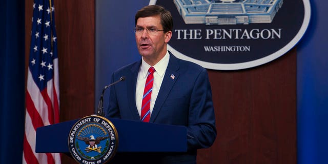 In this image provided by the Department of Defense, Secretary of Defense Mark Esper speaks to members of the media during a press conference to discuss the Department's efforts to respond to the COVID-19 pandemic at a Pentagon briefing in Washington, Monday, March 23.  2020 (Army Staff Sergeant Nicole Mejia/Department of Defense via AP)