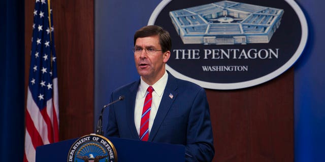 In this image provided by the Department of Defense, Defense Secretary Mark Esper speaks to members of the media during a news conference to discuss the department's efforts in response to the COVID-19 pandemic at the Pentagon Briefing Room in Washington, on Monday, March 23, 2020. (Army Staff Sgt. Nicole Mejia/Department of Defense via AP)