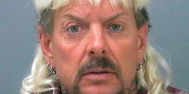 This file photo provided by the Santa Rosa County Jail in Milton, Fla., shows Joseph Maldonado-Passage, also known as "Joe Exotic." Maldonado-Passage was convicted in an unsuccessful murder-for-hire plot against Carole Baskin, the founder of Big Cat Rescue, who he has repeatedly accused of killing her husband Jack "Don" Lewis. Lewis' unsolved 1997 disappearance and Maldonado-Passage's accusations are the subject of new Netflix series "Tiger King." (Santa Rosa County Jail via AP, File)