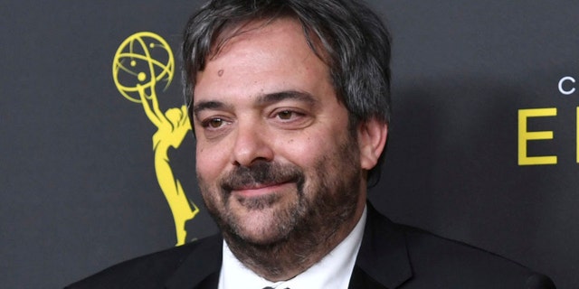 FILE - This Sept. 14, 2019 file photo shows Adam Schlesinger, winner of the awards for outstanding original music and lyrics for 'Crazy Ex Girlfriend,' in the press room at the Creative Arts Emmy Awards in Los Angeles.