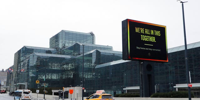 Cars pass the Jacob Javitz convention Center Friday, April 3, 2020, in New York. New York Gov. Andrew Cuomo announced that The Jacob K. Javits Convention Center in New York City will be "converted to a COVID facility." The original plan was that non-COVID patients would go to the convention center and it would be an "overflow for hospitals." (AP Photo/Frank Franklin II)