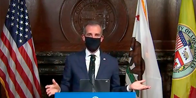 Los Angeles Mayor Garcetti wearing a protective face mask during his daily coronavirus news conference in Los Angeles on April 1. Garcetti is currently conducting all briefings and interviews remotely. (Office of Mayor Eric Garcetti via AP, File)