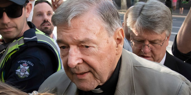 Cardinal George Pell arrives at the County Court in Melbourne, Australia in February. Australia's highest court on Tuesday, April 7, 2020, has dismissed the convictions of the most senior Catholic found guilty of child sex abuse. (AP Photo/Andy Brownbill, File)