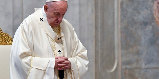 Pope Francis attends a Mass for Holy Thursday, inside St. Peter's Basilica at the Vatican. (Alessandro Di Meo/Pool Photo via AP)