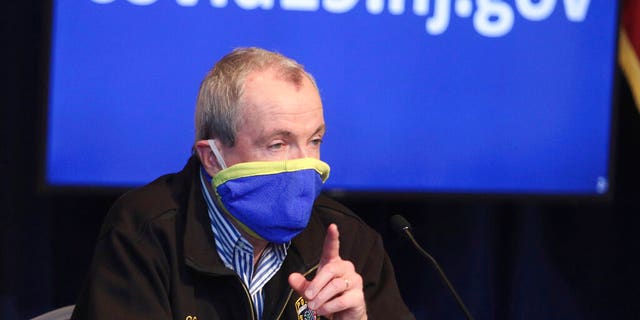 New Jersey Gov. Phil Murphy holds a news conference regarding the COVID-19 cases at the War Memorial in Trenton, N.J. on Saturday, April 11, 2020. Murphy says he is ordering state transit systems to reduce their capacity by half and will require all transit riders to wear face coverings.