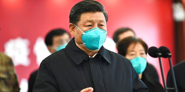 In this Tuesday, March 10, 2020, photo released by China's Xinhua News Agency, Chinese President Xi Jinping talks by video with patients and medical workers at the Huoshenshan Hospital in Wuhan in central China's Hubei Province.