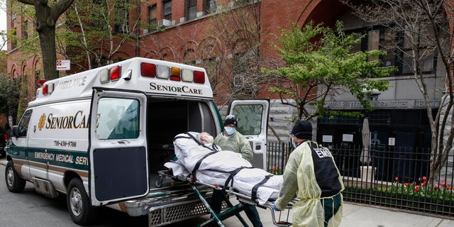 A patient is loaded into the back of an ambulance by emergency medical workers outside Cobble Hill Health Center, Friday, April 17, 2020, in the Brooklyn borough of New York. The despair wrought on nursing homes by the coronavirus was laid bare Friday in a state survey identifying numerous New York facilities where multiple patients have died. Nineteen of the state's nursing homes have each had at least 20 deaths linked to the pandemic. Cobble Hill Health Center was listed as having 55 deaths. (AP Photo/John Minchillo)