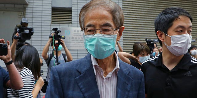 Former pro-democracy lawmaker Martin Lee, 81-year-old, second right, leaves a police station in Hong Kong, Saturday, April 18, 2020.