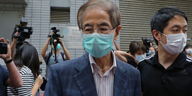 Former pro-democracy lawmaker Martin Lee, 81, center, leaves a police station in Hong Kong, Saturday, April 18, 2020. (Associated Press)