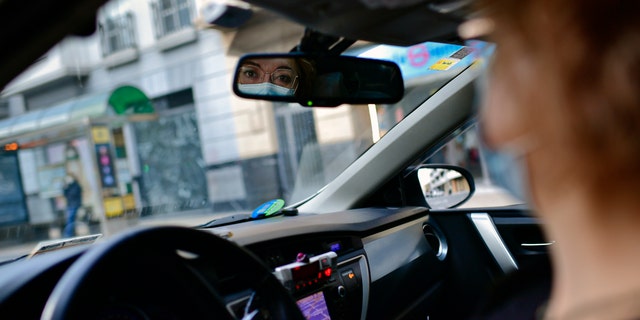 Taxi driver Isabel Zarranz poses for a photograph inside her taxi in Pamplona, northern Spain. (AP Photo/Alvaro Barrientos)