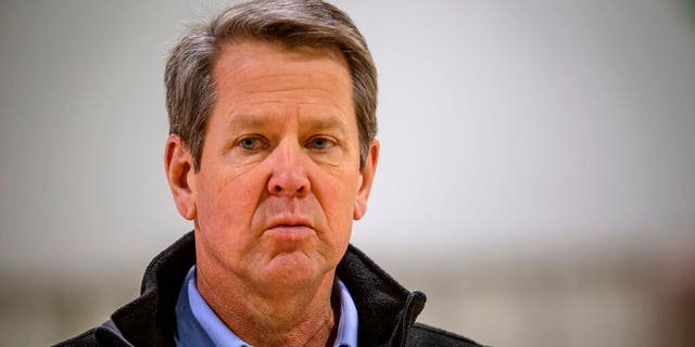 In this April 16, 2020, file photo, Georgia Gov. Brian Kemp listens to a question from the press during a tour of a temporary hospital at the Georgia World Congress Center in Atlanta. 