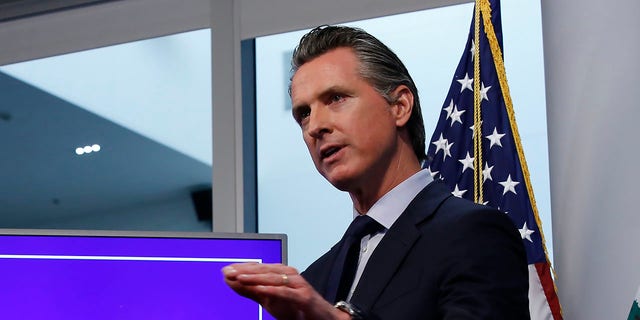 In this Tuesday April 14, 2020, file photo, California Gov. Gavin Newsom discusses an outline for what it will take to lift coronavirus restrictions, during a news conference at the Governor's Office of Emergency Services in Rancho Cordova, Calif. On Wednesday, April 22, Newson announced hospitals can resume scheduled surgeries. It's the first significant change to the state's stay-at-home order. 