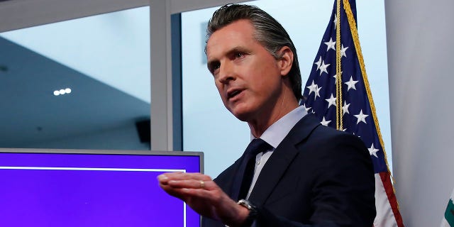 In this Tuesday April 14, 2020, file photo, California Gov. Gavin Newsom discusses an outline for what it will take to lift coronavirus restrictions, during a news conference at the Governor's Office of Emergency Services in Rancho Cordova, Calif. On Wednesday, April 22, Newson announced hospitals can resume scheduled surgeries. It's the first significant change to the state's stay-at-home order. 