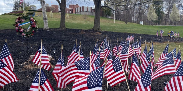 Flags and wreaths honor veterans on the grounds of the Soldiers' Home in Holyoke, Mass., Tuesday, April 28, 2020. (Associated Press)