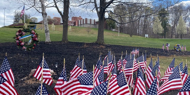 Flags and wreaths honor veterans on the grounds of the Soldiers' Home in Holyoke, Mass., Tuesday, April 28, 2020. (Associated Press)